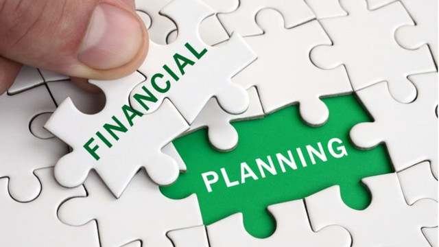 Jigsaw puzzle spelling out financial planning